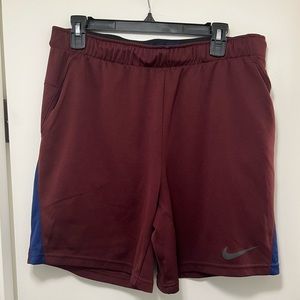 Nike Large Mens Shorts. 9inch seem right above the knee. Dark Red